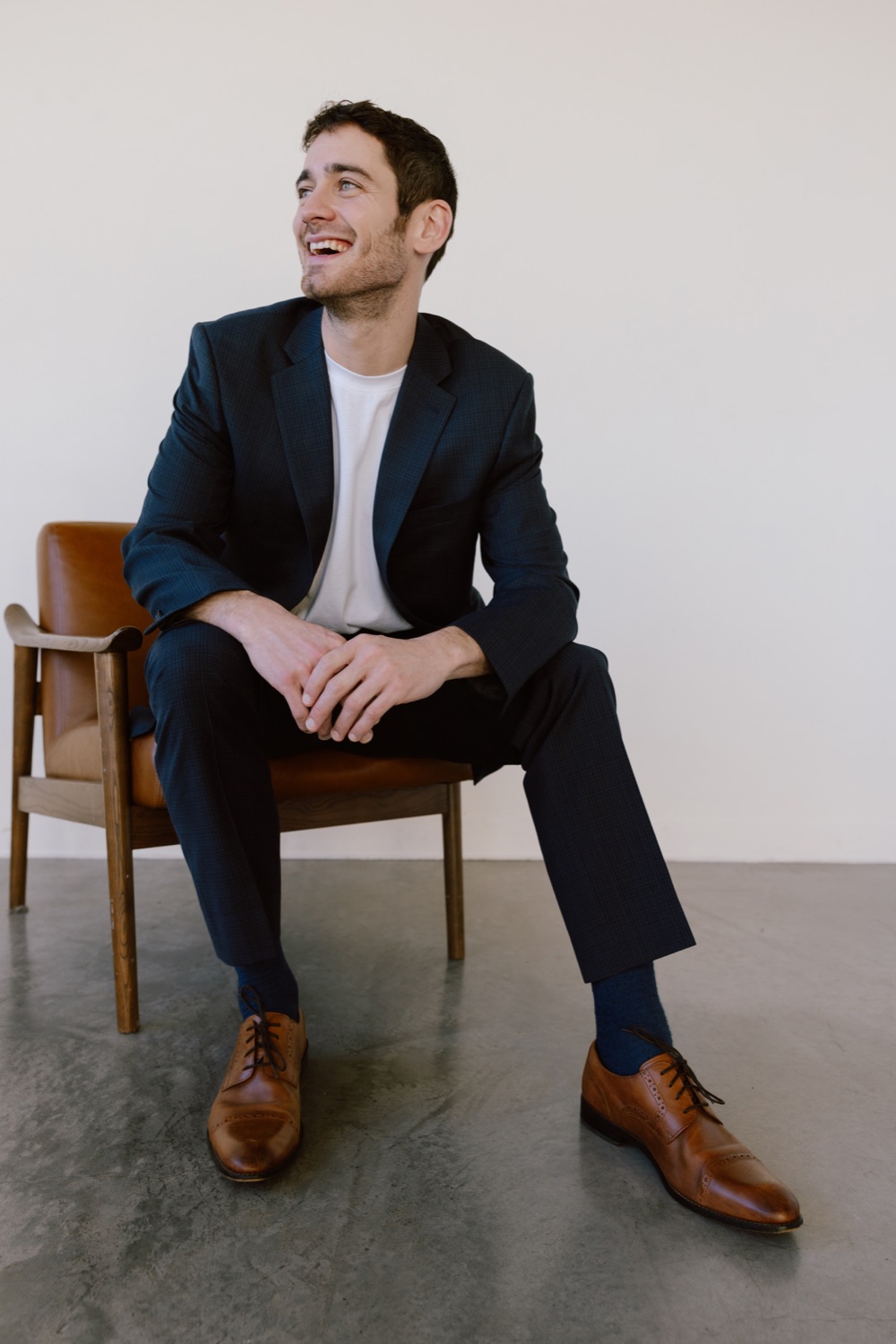Dan Gomez smiling, seated in a chair